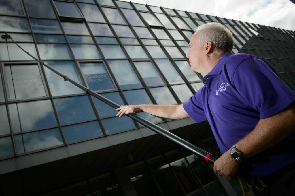 Facilities Management Cleaning Services for Queens University. Cleaning Operative working outdoors